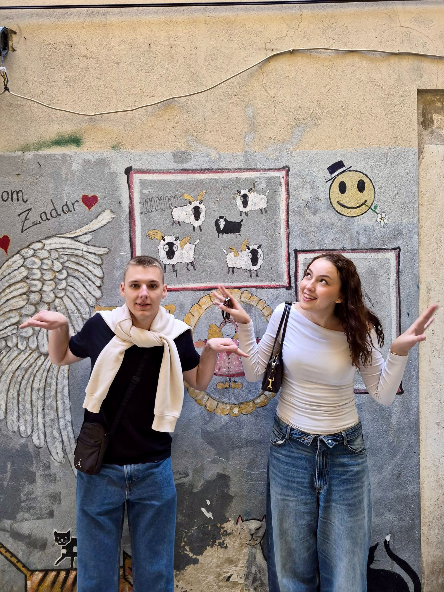 Couple in front of the colorful Zadar Old Town mural